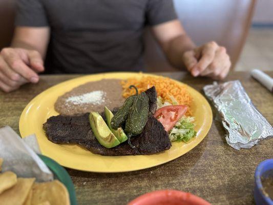 Steak refried beans and yellow rice. The flavor of the steak was soo good!