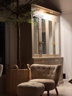 Brass cremone bolts, pulls and picture light against the perfect creamy taupe.