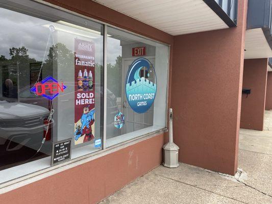 Rear (lower) entrance to store from back parking lot