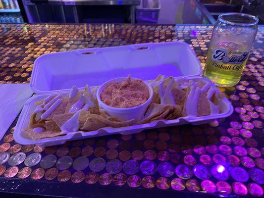 Buffalo chicken dip with fresh chips, drizzled, and ranch! Dynamite.