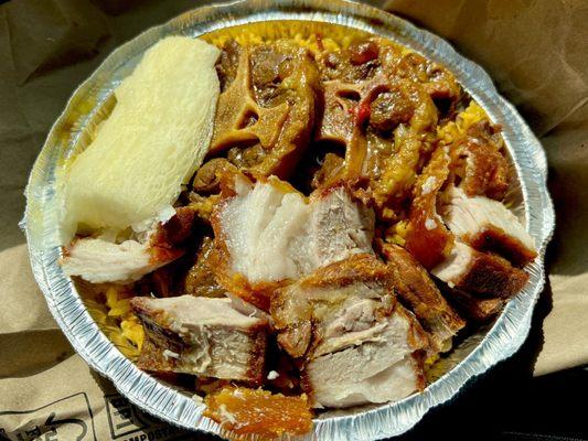 My take home large container - yellow rice, with yuca, crispy pork, ox tail - yummy! About $25