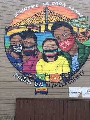 Mask on mural in the Fruitavale.