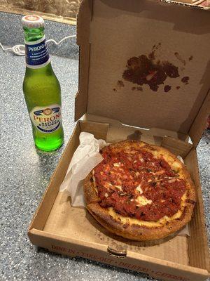 Deep Dish pizza and a Peroni beer.