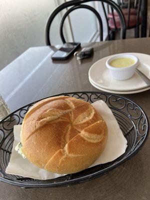 Sliced roll with flavorful green sauce. A tad spicy, has a pesto flavor to it-yum!