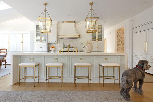 Beaded inset white perimeter cabinets, blue 10' island. metal hood, large island pendants, gold finishes, cremone bolts, custom cabinets