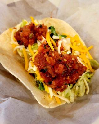 Grilled chicken taco "gringo style" topped with fresh made habanero salsa