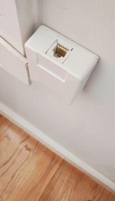 Telephone jack installed. Drilled through the wall in window and caulked the holes.