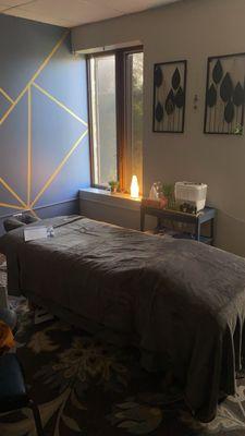 I love how inviting her massage space is!