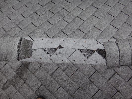 Missing roof shingles.