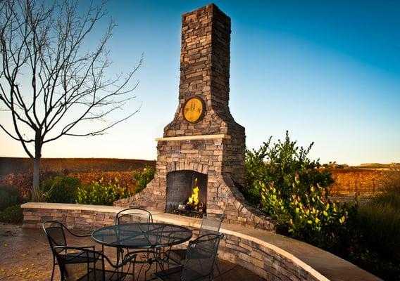 The outdoor fireplace overlooking the vineyard.