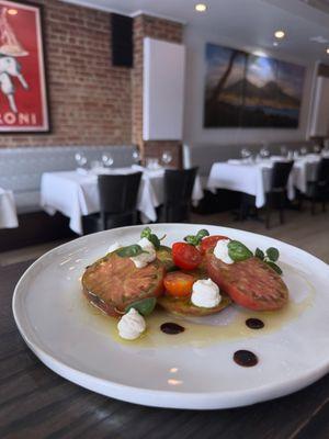 Heirloom tomatoes with ricotta cheese, aged Balsamic, and olive oil