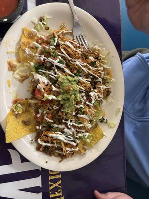 Half eaten nachos supreme