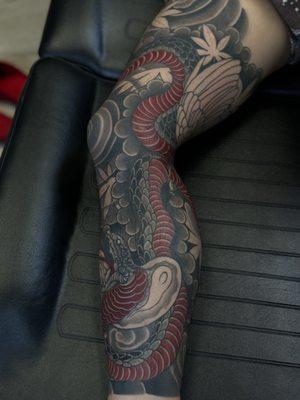 Snake and hawk tattoo