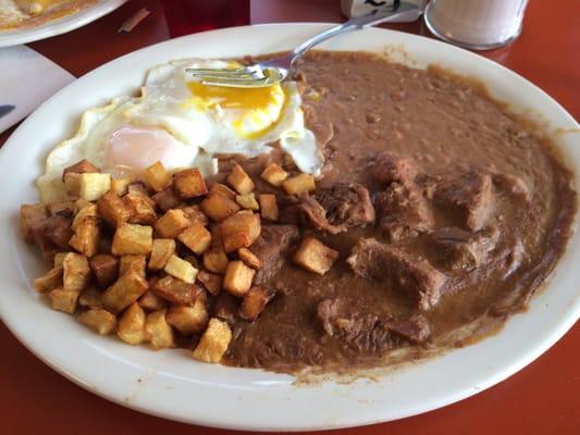 Carne guisada breakfast with 2 over medium eggs & fresh flour tortillas. Yum!!! Salsa w xtra spicy.