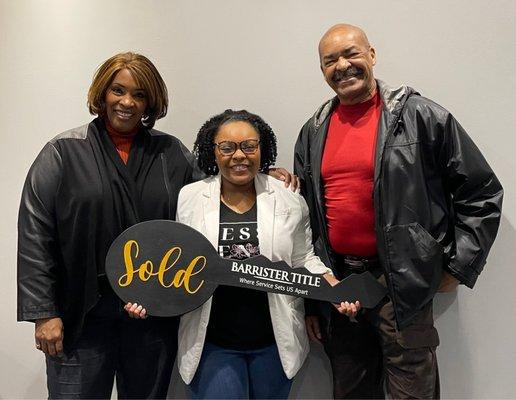 New Home Owner (center) with proud parents!