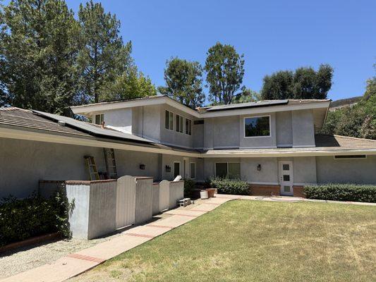 Showing the back side of the house panel installation again, away from approaching the house.