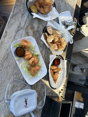 Chips, coconut shrimp, mozz sticks, and chicken fingers.