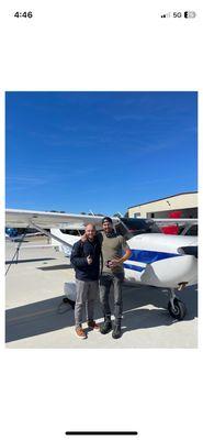 Standing next to plane after a successful check ride
