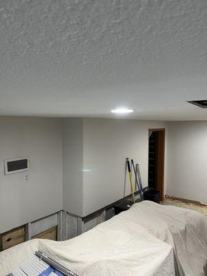 After water damage, we restored and upgraded this basement.