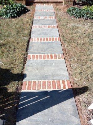 Blue stone flag with red brick divider