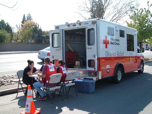 Volunteers assisting a family after a single family fire.