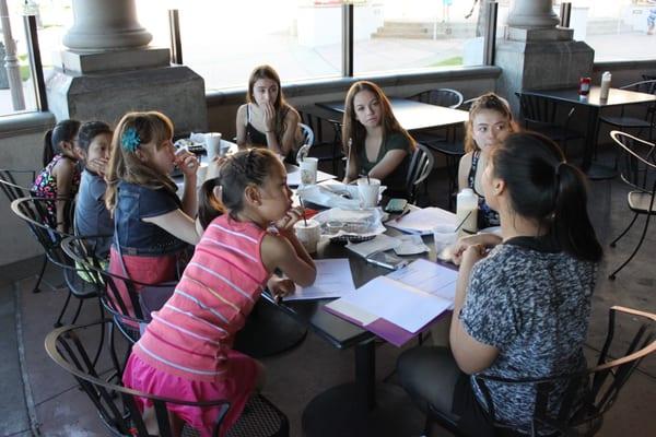Sidney, Paige, Erin, Andrea, Audrey, Erin, and Raelyn put their heads together and plan for ways to get Academy of Dance Arts...
