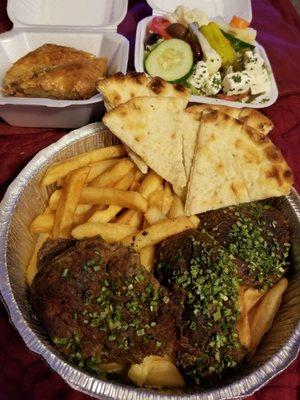 Beef souvlaki, fries, pita bread, and Greek salad with feta and kalamata olives. Finish off with baklava. It doesn't get any better!