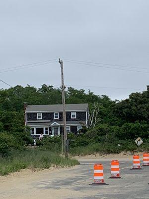 The sign stating it's a private beach is behind that telephone pole.