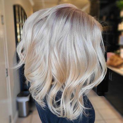 Bleach out blonding with a root shadow.