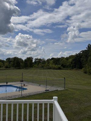 Large yard mowed and trimmed for a clean, even look.