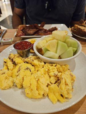 Dry and cold eggs with bits of bacon, when we asked for fresh scrambled eggs with melted cheddar.