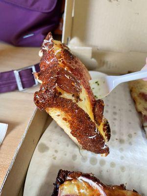 Detroit style pepperoni pizza slice