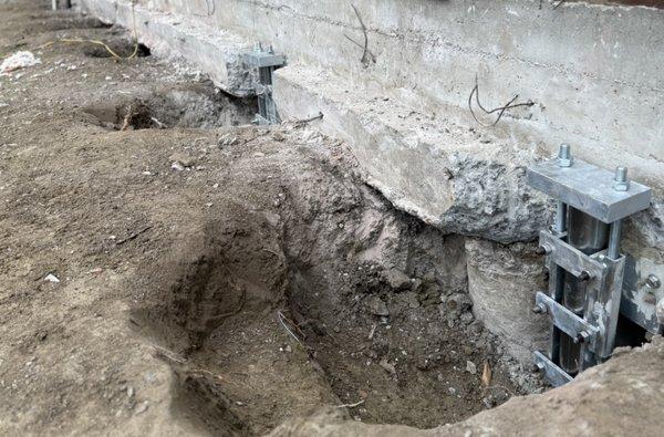 Concrete Piers and Push Piers Along Grade Beam Foundation