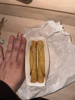 Paid 7.50 for an order of taquitos???... hand for size reference. This is just wrong.