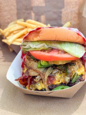 "Big city bagon" with grilled onions and green chile