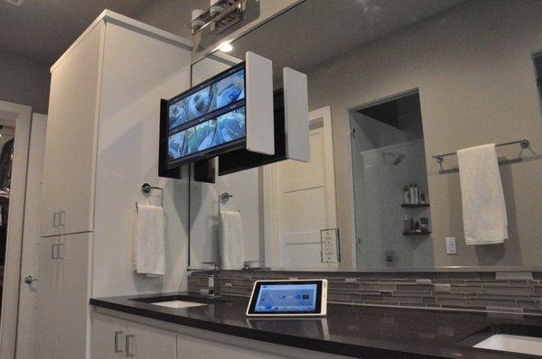 Custom built, hidden bathroom TV with iPad control