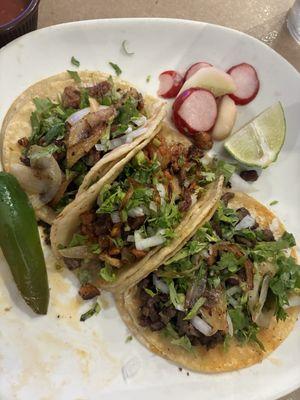 Tripa, steak and pastor tacos with corn tortillas