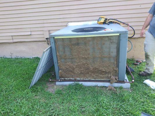 obvious grass clippings on coil causing h & a unit to not work