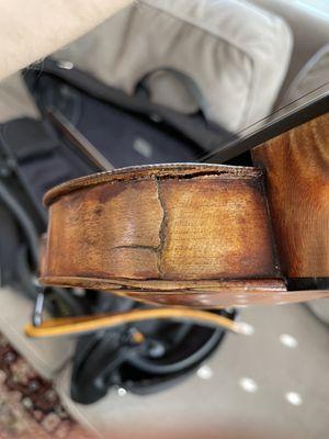 Here is an example of the crack that opened up between the top and the ribs after a Paul Schuback repair.