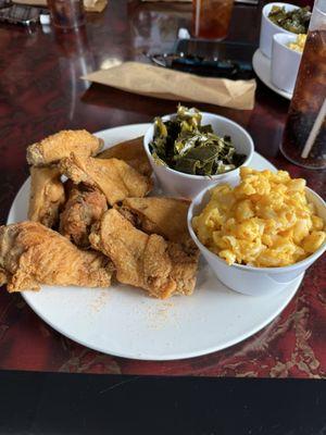 Oh man! My favorite food in the whole wide world! Fresh cooked chicken wings ( breaded in house) with Mac n cheese and collard greens!