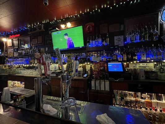 On tap and bottles. Footie on the TV.