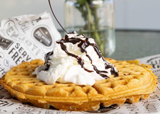 Whipped cream , drizzled with chocolate