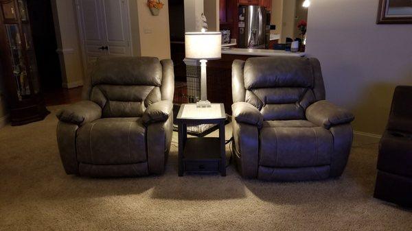Matching power recliners with lumbar and head rest support.
