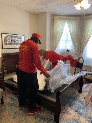 Carefully taking the plastic off the mattress just about to set it in a frame