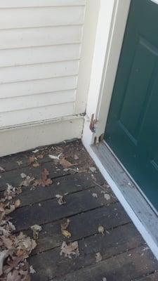 Rotten door jamb caused by not having gutters