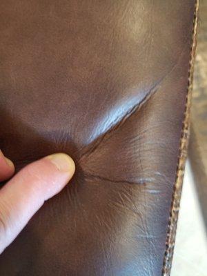 Real leather does not wrinkle like this.