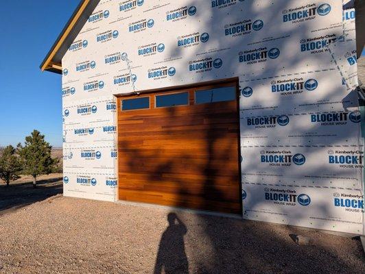 My highlifted modern steel wood colored doors installed by One Clear Choice.