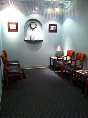 Small yet cozy waiting area with 6 large chairs for seating.