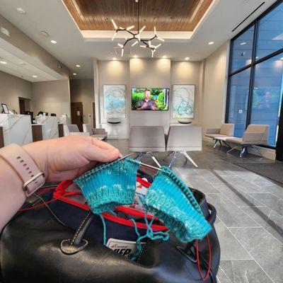 Knitting while I wait. Lobby is beautiful!