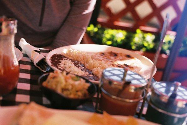 Steak and cheese pupusa with Rice and Beans
